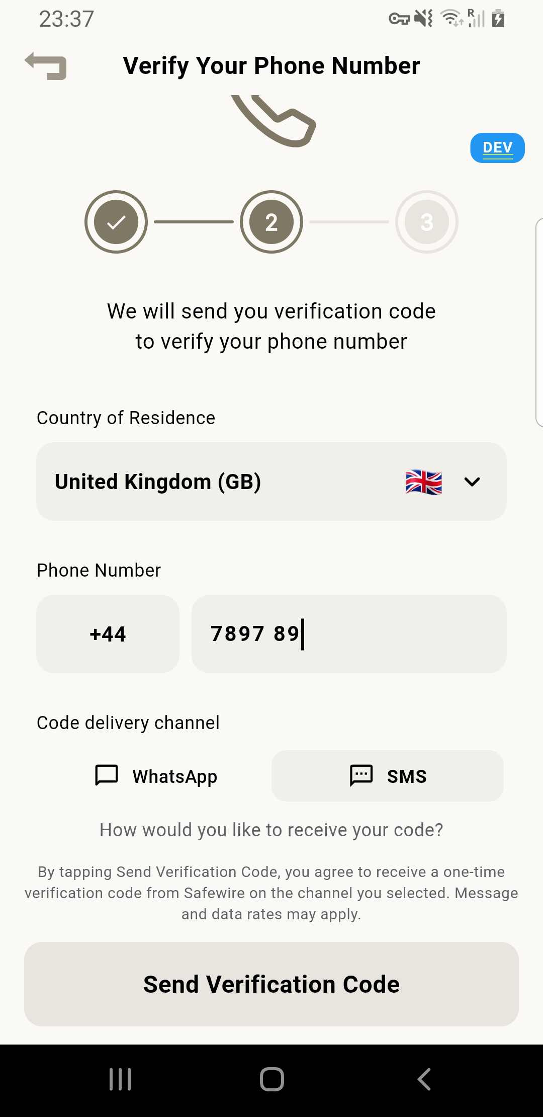 Safewire wallet "Verify Your Phone Number" screen showing the country picker, the phone number field the user types into, the WhatsApp / SMS channel selector, and the consent sentence displayed directly above the Send Verification Code button.